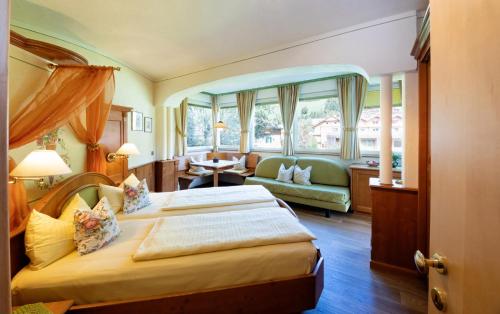 En eller flere senge i et værelse på Residence Intica