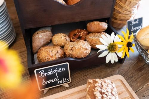 a tray of different types of pastries on a table at Parkhotel Herne in Herne