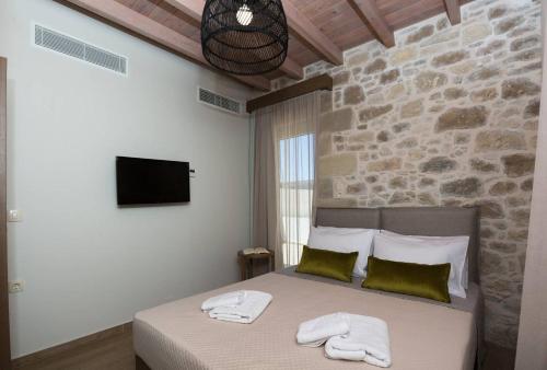 Ένα ή περισσότερα κρεβάτια σε δωμάτιο στο Kamartos Villa 1