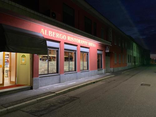 an empty street in front of a store at Albergo Ristorante Brera in Inveruno
