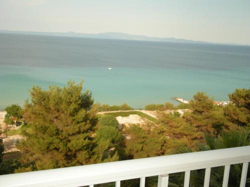 a view of the ocean from the balcony of a house at Drenos Rooms view in Kallithea Halkidikis