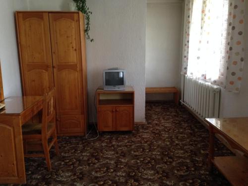 a room with a small television sitting on a table at Katerina Family Hotel in Smolyan