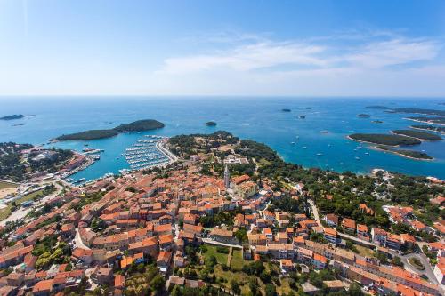 an aerial view of a city and the water at Victoria Mobilehome in Orsera Camping Resort in Vrsar