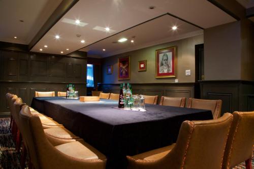 a conference room with a long table and chairs at Manchester South Hotel, Sure Hotel Collection by BW in Manchester