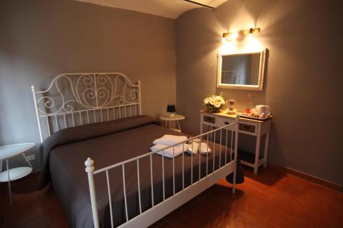 Postel nebo postele na pokoji v ubytování Il sogno di maggy