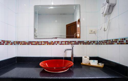 a bathroom with a red bowl on a sink at Little Paradise Haad Rin Koh Phangan in Haad Rin