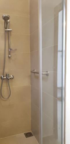 a bathroom with a shower with a glass door at Memory Lane in Colombo