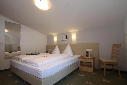 Postel nebo postele na pokoji v ubytování Ferienwohnungen Sonderegger