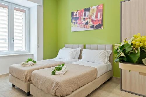 Llit o llits en una habitació de Devon Metro Studio Apartments
