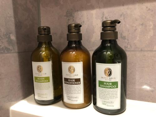 three bottles of wine sitting on a shelf at Condominium MIRAHAKONE in Hakone