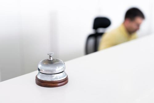 a silver bell sitting on top of a counter at Hotel Spa Calagrande Cabo de Gata in Las Negras