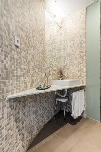 a bathroom with a sink and a mirror at Hotel Spa Calagrande Cabo de Gata in Las Negras