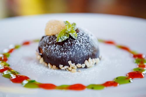 a dessert on a plate on a white plate at Галицька Корона in Lviv