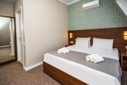 Cama o camas de una habitación en Margi Boutique Hotel by DNT Group