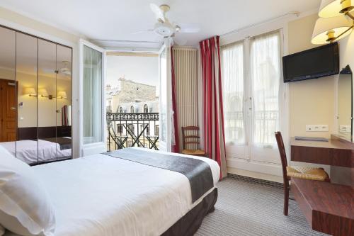 Katil atau katil-katil dalam bilik di Hotel du College de France