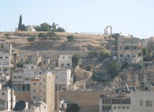 a group of buildings on top of a hill at Farah Hotel in Amman