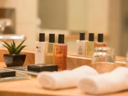 a pile of products sitting on a table in front of a mirror at Dan Panorama Jerusalem Hotel in Jerusalem