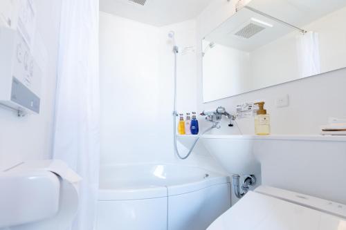 Een badkamer bij Doutonbori Crystal Hotel IV