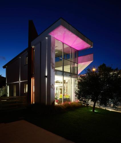 a building with a lit up facade at night at Best Western Hotel Rome Airport in Fiumicino