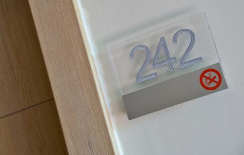 a sign on a door with the number on it at Best Western Hotel Rome Airport in Fiumicino