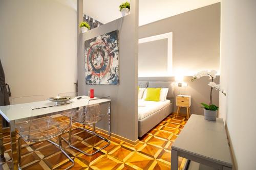 a living room with a couch and a table at Maison Amelie in Trieste