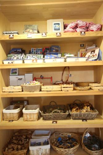 a shelf filled with lots of baskets and other items at Mecavnik Resort in Mokra Gora