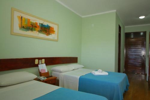 Llit o llits en una habitació de Hotel Pousada Dos Ventos