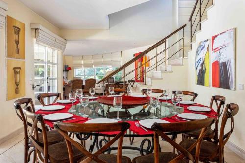 a dining room with a glass table and chairs at Luxury Villa 6 bedrooms with private pool in Vilamoura
