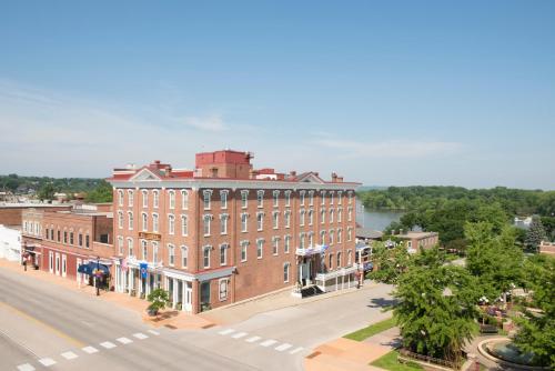 a large brick building on the side of a street at St James Hotel in Red Wing