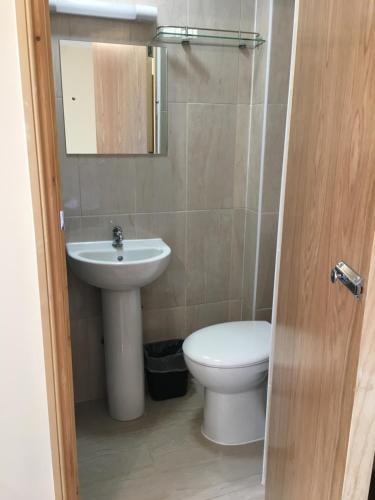 a bathroom with a toilet and a sink at 15 New Row in London