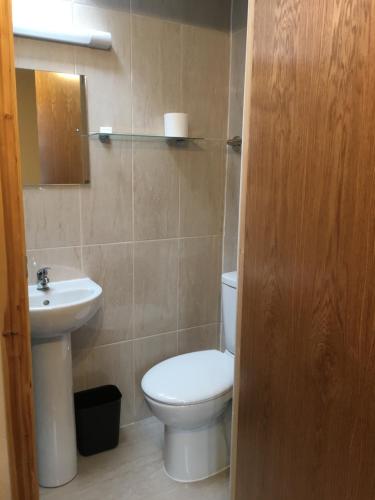a bathroom with a toilet and a sink at 15 New Row in London