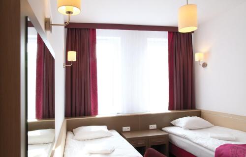 Ένα ή περισσότερα κρεβάτια σε δωμάτιο στο Arche Hotel Siedlce