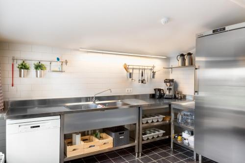 Virtuvė arba virtuvėlė apgyvendinimo įstaigoje Cottage de Vinck