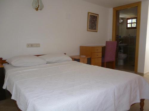 Ένα ή περισσότερα κρεβάτια σε δωμάτιο στο Frankfurt Hotel