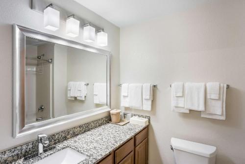 A bathroom at MainStay Suites Cedar Rapids North - Marion