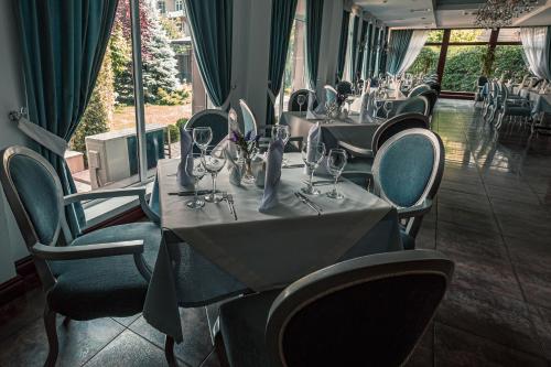 a row of tables and chairs in a restaurant at Park Hotel Bishkek in Bishkek