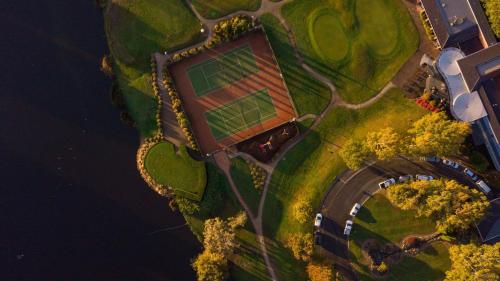 an aerial view of a field with a tennis court at Country Club Tasmania in Launceston
