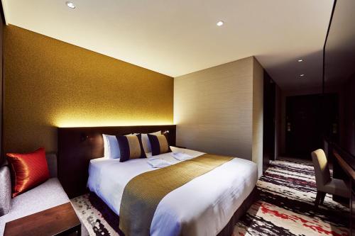 Ein Bett oder Betten in einem Zimmer der Unterkunft The Gate Hotel Tokyo by Hulic
