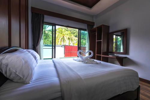 Postel nebo postele na pokoji v ubytování Wanna Dream Pool Villas Ao Nang