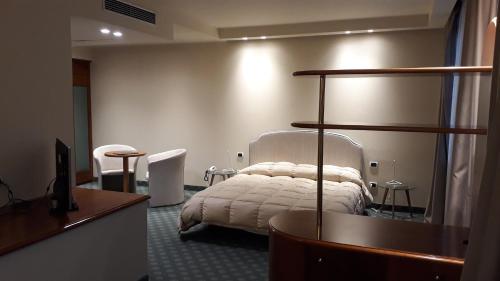 a bedroom with a bed in a room at Hostellerie Du Cheval Blanc in Aosta