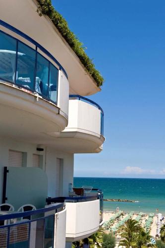 a view of the ocean from the balcony of a building at Residence Oltremare in San Benedetto del Tronto