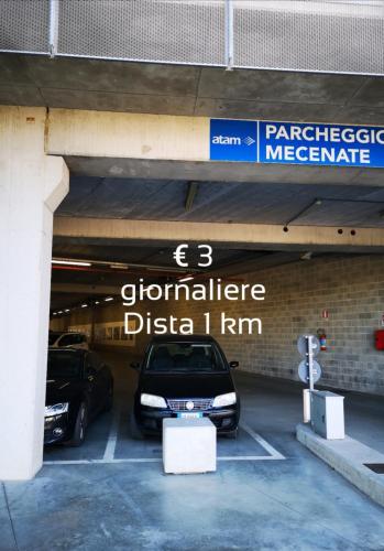 a parking garage with two cars parked in it at La Casina dell'Agania in Arezzo