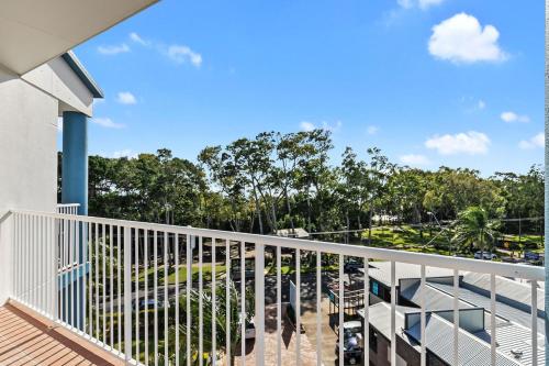 a balcony with a view of a park at White Crest Apartments in Hervey Bay