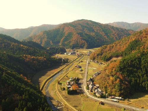 an aerial view of a valley in the mountains at Ryokan Kigusuriya in Nantan city
