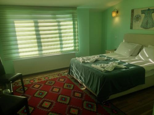 Кровать или кровати в номере KEMAL STONE HOUSE HOTEL.