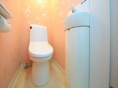 a bathroom with a toilet and a sink at COTO Tokyo Shibuya 3 in Tokyo