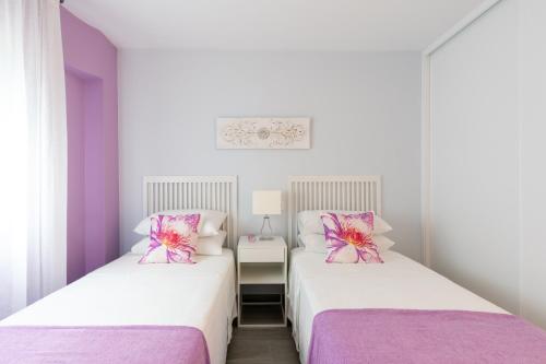 A bed or beds in a room at UNIQUE HOMES LAS SETAS LA CAMPANA