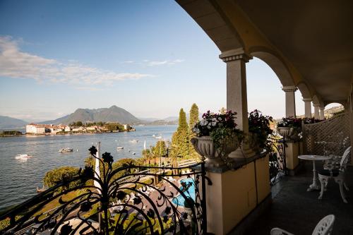 a view of the water from the balcony of a restaurant at Hotel Villa e Palazzo Aminta in Stresa