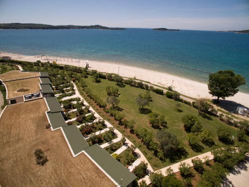 an aerial view of a park next to the beach at Victoria Mobilehome BI VILLAGE in Fažana