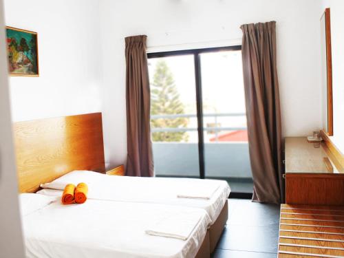 Säng eller sängar i ett rum på Rebioz Hotel